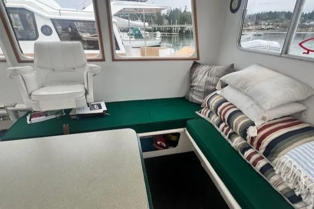 Slide: The Image of 1972 REPCO Buxton Downeast Hardtop Cruiser interior with green seating and striped pillows. - 11