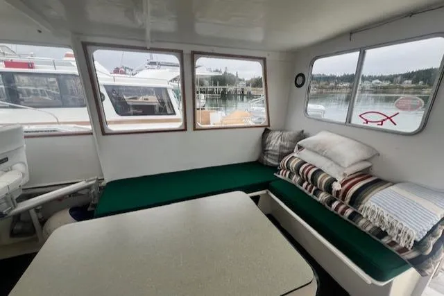Slide: The Image of Interior of a 1972 REPCO Buxton Downeast Hardtop Cruiser with green seating and windows. - 12