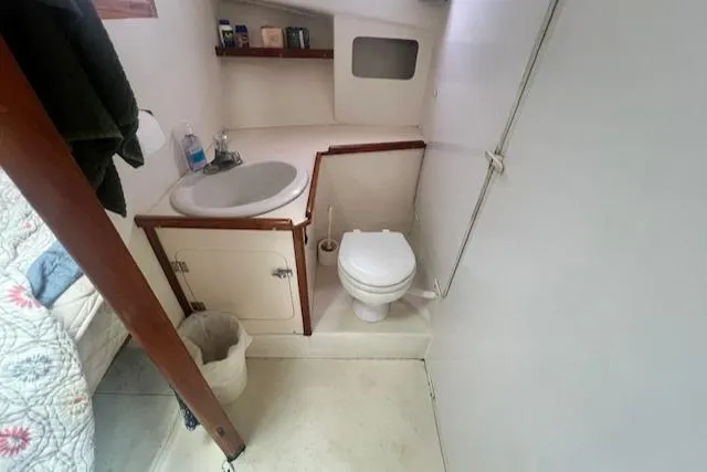 Slide: The Image of 1972 REPCO Buxton Downeast Hardtop Cruiser bathroom with sink, toilet, and storage. - 15