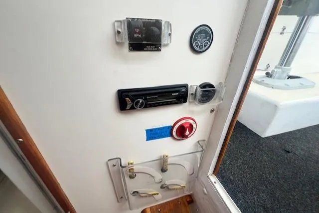 Slide: The Image of Control panel inside a 1972 REPCO Buxton Downeast Hardtop Cruiser boat. - 16
