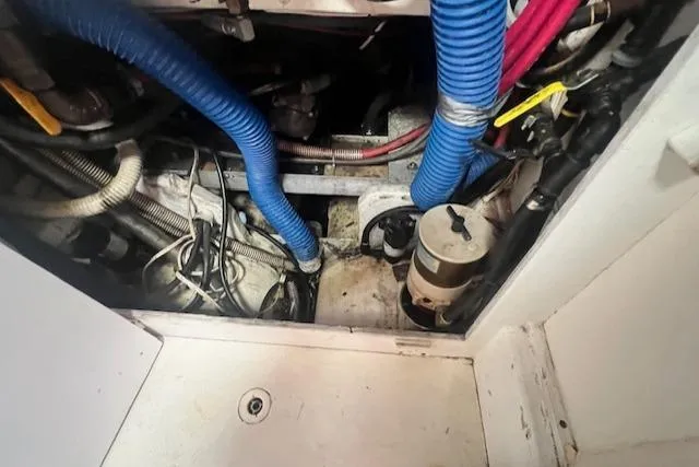 Slide: The Image of Engine compartment of a 1972 REPCO Buxton Downeast Hardtop Cruiser with visible hoses and wiring. - 18