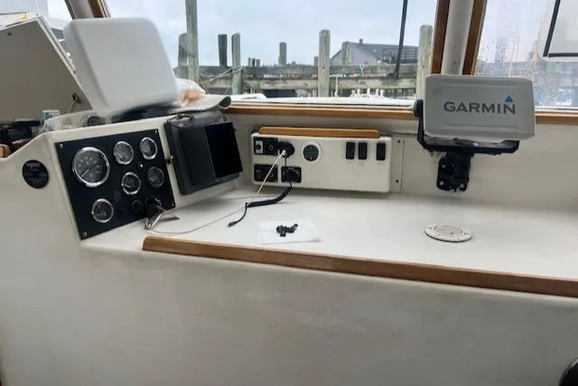 Slide: The Image of 1972 REPCO Buxton Downeast Hardtop Cruiser dashboard with Garmin navigation system. - 2