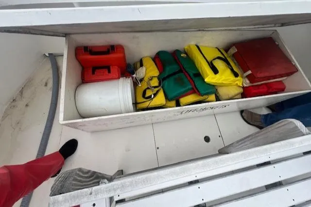Slide: The Image of Storage compartment on a 1972 REPCO Buxton Downeast Hardtop Cruiser with life jackets and safety gear. - 22