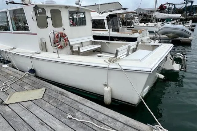 Slide: The Image of 1972 REPCO Buxton Downeast Hardtop Cruiser docked at a marina. - 29