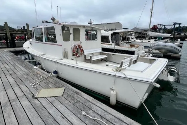 Slide: The Image of 1972 REPCO Buxton Downeast Hardtop Cruiser docked at a marina. - 31