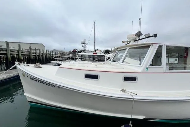 Slide: The Image of 1972 REPCO Buxton Downeast Hardtop Cruiser docked at marina under cloudy sky. - 33