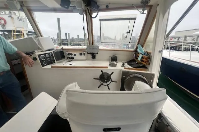 Slide: The Image of 1972 REPCO Buxton Downeast Hardtop Cruiser interior with steering wheel and navigation equipment. - 4