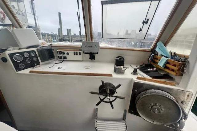 Slide: The Image of 1972 REPCO Buxton Downeast Hardtop Cruiser helm with navigation equipment and steering wheel. - 5