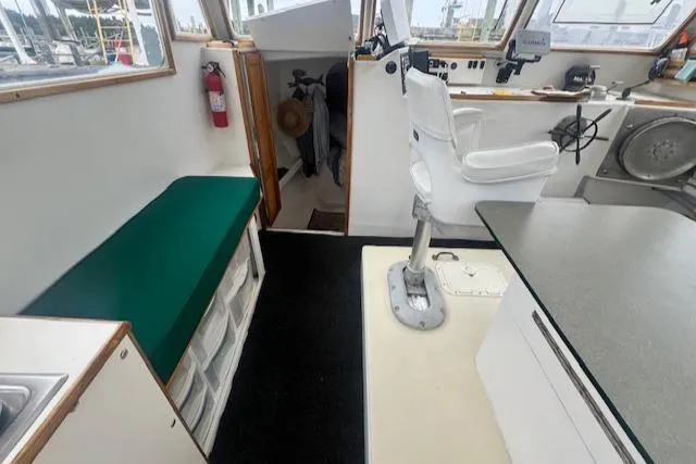 Slide: The Image of 1972 REPCO Buxton Downeast Hardtop Cruiser interior with helm, seating, and storage. - 9