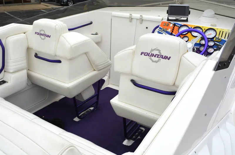 Slide: The Image of Interior of 2007 Fountain 35 Executioner boat with white and purple seating. - 11