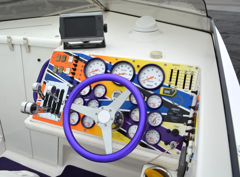 Slide: The Image of Colorful dashboard of a 2007 Fountain 35 Executioner boat with gauges and controls. - 15