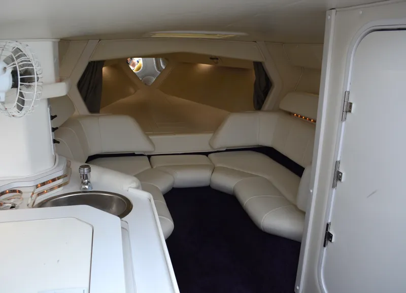 Slide: The Image of Luxurious interior of 2007 Fountain 35 Executioner boat with white seating and kitchenette. - 16