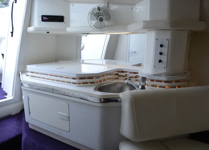 Slide: The Image of Interior of 2007 Fountain 35 Executioner boat with sink and seating area. - 23
