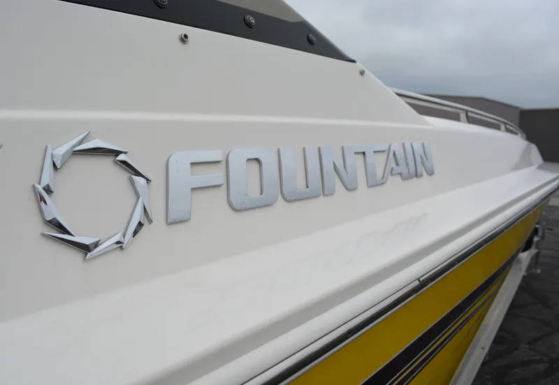 Slide: The Image of Close-up of 2007 Fountain 35 Executioner boat logo on yellow and white hull. - 3