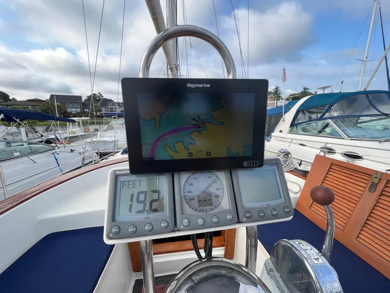 Slide: The Image of Cockpit of 1981 Endeavour 40 sailboat with navigation instruments and chartplotter. - 10