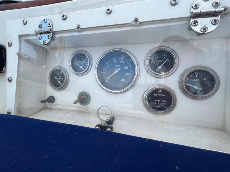 Slide: The Image of Instrument panel of a 1981 Endeavour 40 sailboat with gauges and switches. - 12