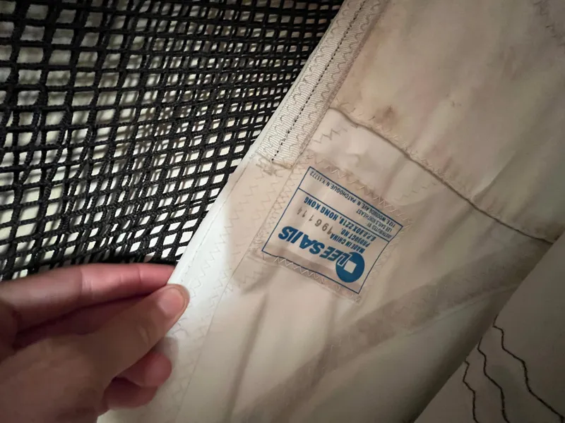 Slide: The Image of Close-up of a sail with a label, Endeavour 40, 1981 model. - 33