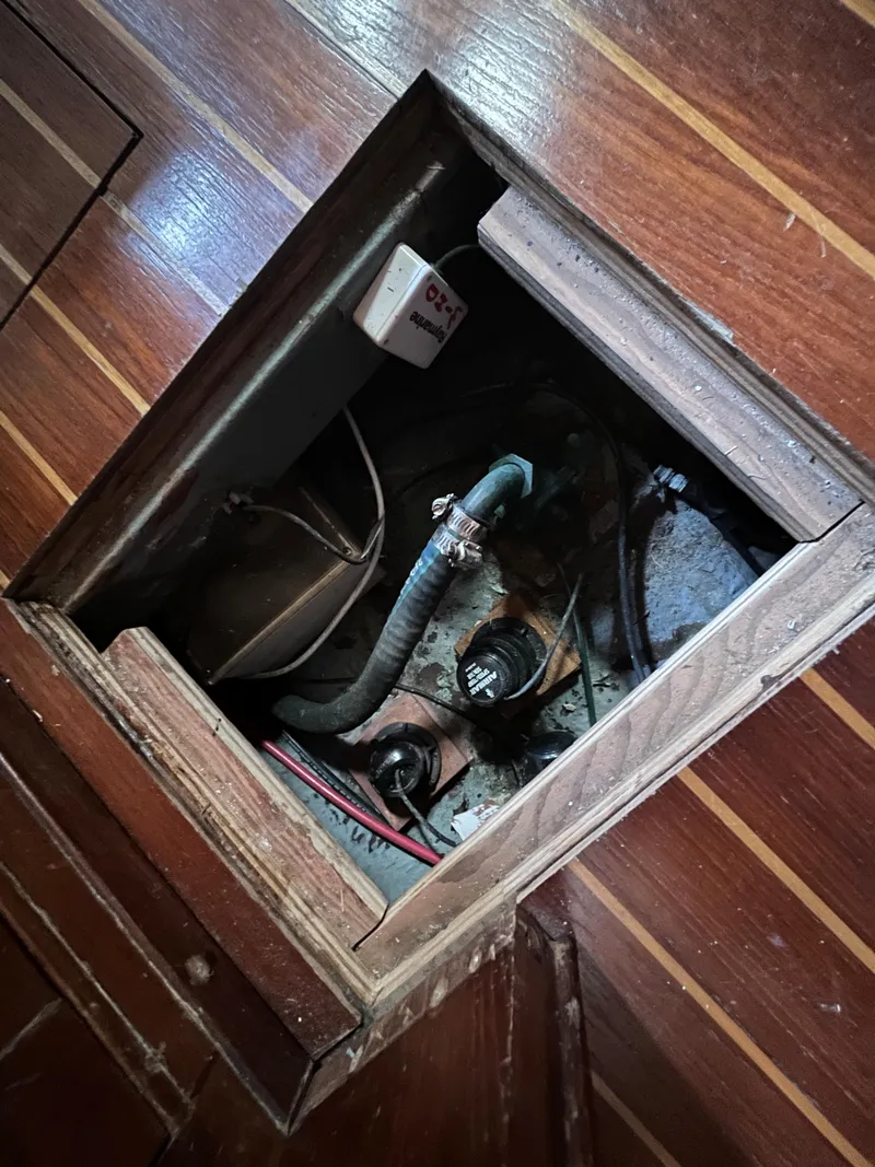 Slide: The Image of Access hatch on 1981 Endeavour 40 boat, revealing internal components and wiring. - 36