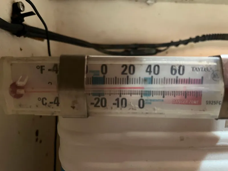 Slide: The Image of Thermometer displaying temperature in Fahrenheit and Celsius, mounted on Endeavour 40, 1981 model. - 41