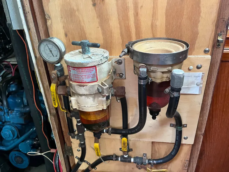 Slide: The Image of Fuel filtration system in a 1981 Endeavour 40 sailboat engine compartment. - 42