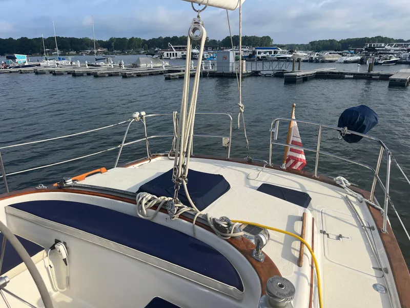 Slide: The Image of 1981 Endeavour 40 sailboat docked at marina, featuring deck and rigging. - 6