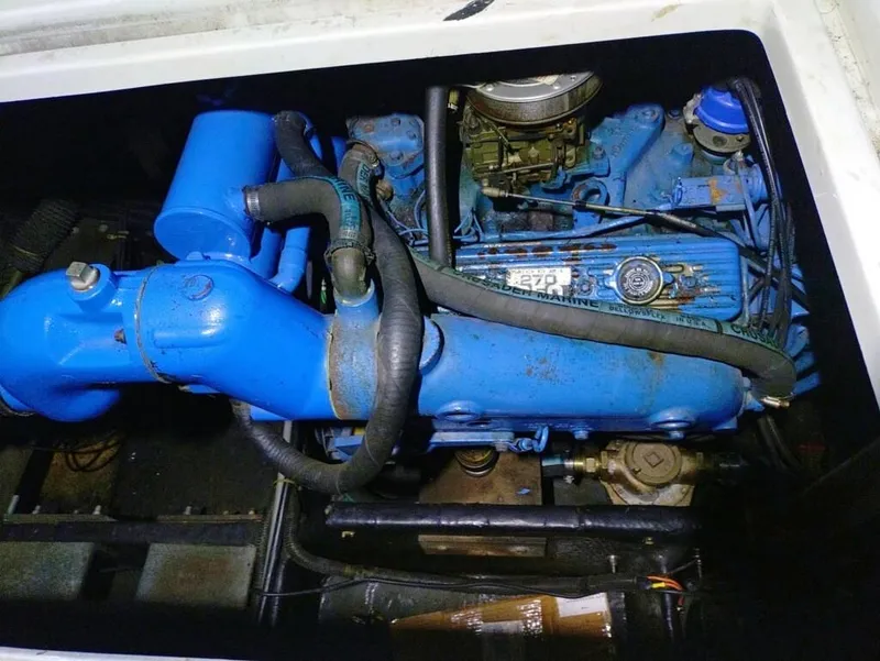 Slide: The Image of 1988 Carver Mariner 32 engine, blue components, detailed view. - 27