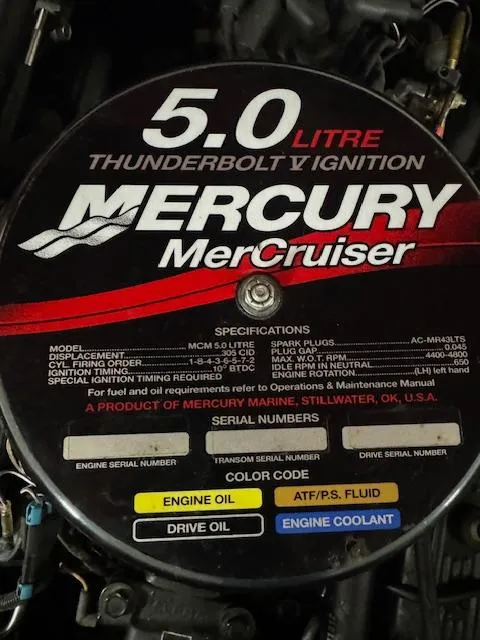 Slide: The Image of Engine cover of a 2001 Bayliner Capri 195 LX with Mercury MerCruiser 5.0L Thunderbolt V Ignition. - 10