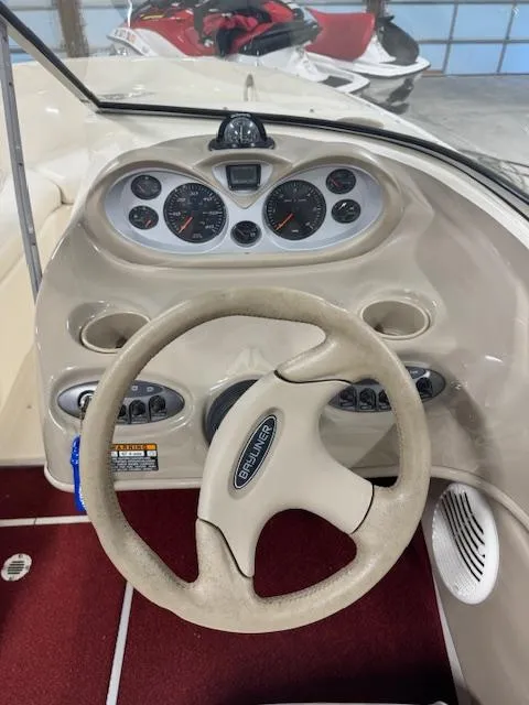 Slide: The Image of 2001 Bayliner Capri 195 LX dashboard with steering wheel and instrument panel. - 12