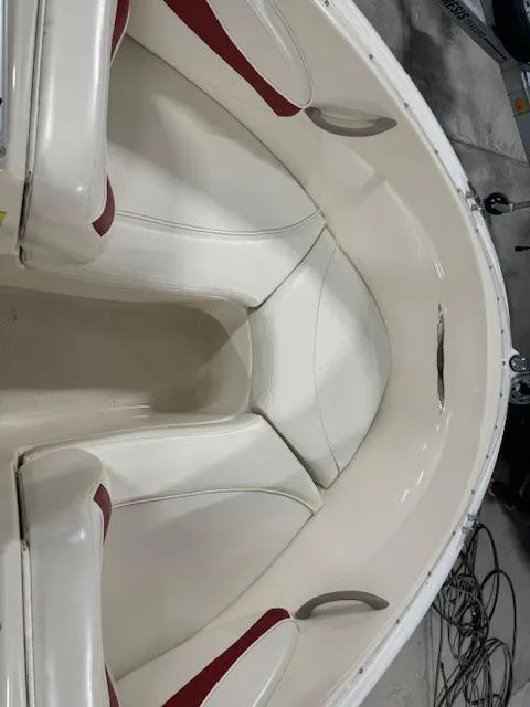Slide: The Image of 2001 Bayliner Capri 195 LX boat interior with white and red seating. - 13
