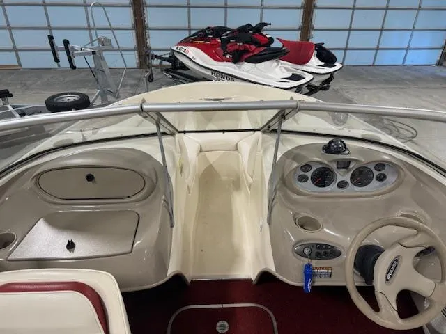Slide: The Image of 2001 Bayliner Capri 195 LX boat interior with dashboard and steering wheel. - 14