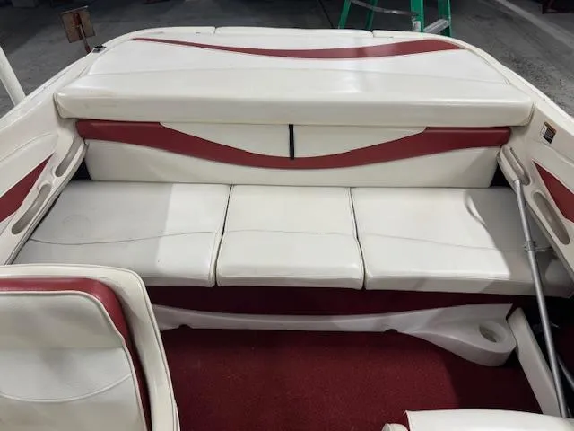 Slide: The Image of 2001 Bayliner Capri 195 LX boat interior with white and red seating. - 15