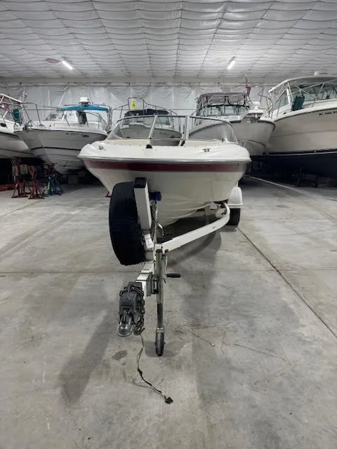 Slide: The Image of 2001 Bayliner Capri 195 LX boat in indoor storage facility. - 5