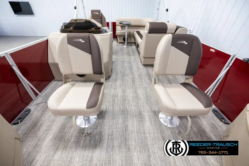 Slide: The Image of 2025 Bennington 188 SSSE boat interior with beige and brown seating, red side panels. - 13
