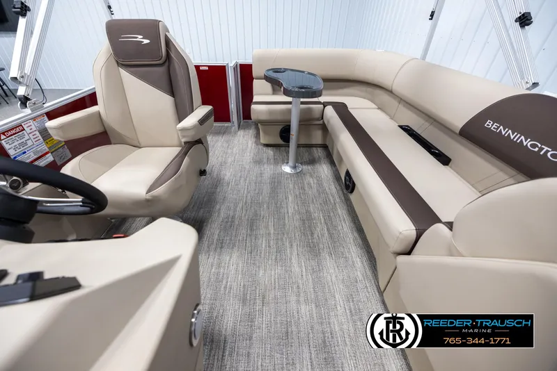 Slide: The Image of Luxurious interior of 2025 Bennington 188 SSSE pontoon boat with plush seating. - 14