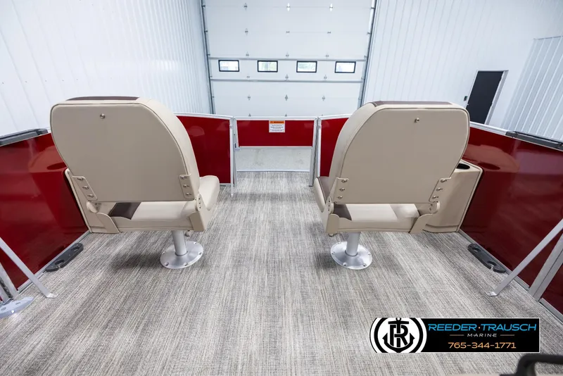 Slide: The Image of 2025 Bennington 188 SSSE boat interior with beige seats and red accents. - 18