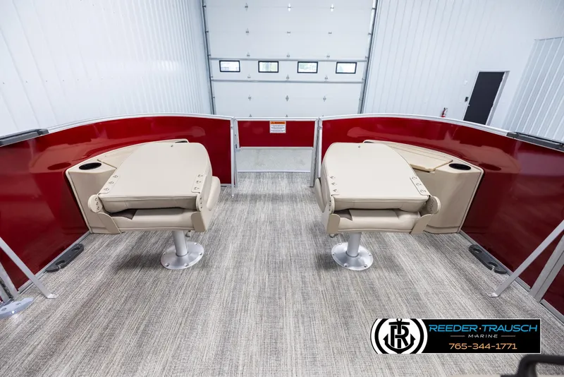 Slide: The Image of 2025 Bennington 188 SSSE boat interior with beige seats and red paneling. - 19