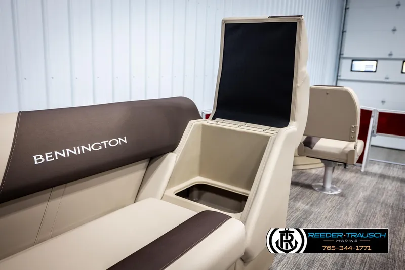 Slide: The Image of 2025 Bennington 188 SSSE boat interior with storage compartment and seating. - 21