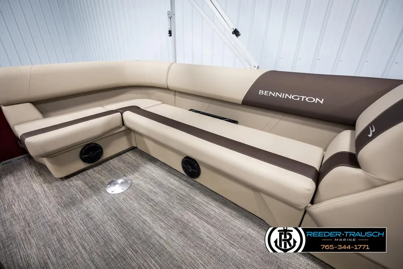 Slide: The Image of 2025 Bennington 188 SSSE boat interior with beige and brown seating. - 22