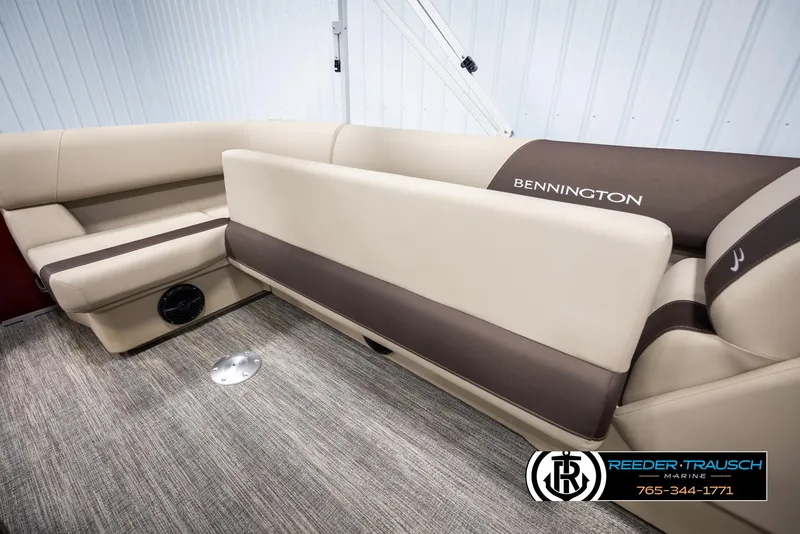 Slide: The Image of 2025 Bennington 188 SSSE boat interior with beige and brown seating. - 23
