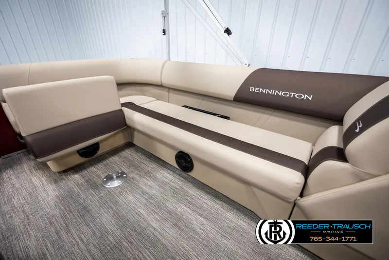 Slide: The Image of 2025 Bennington 188 SSSE boat interior with beige and brown seating. - 24