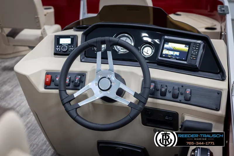 Slide: The Image of 2025 Bennington 188 SSSE boat dashboard with steering wheel and control panel. - 26