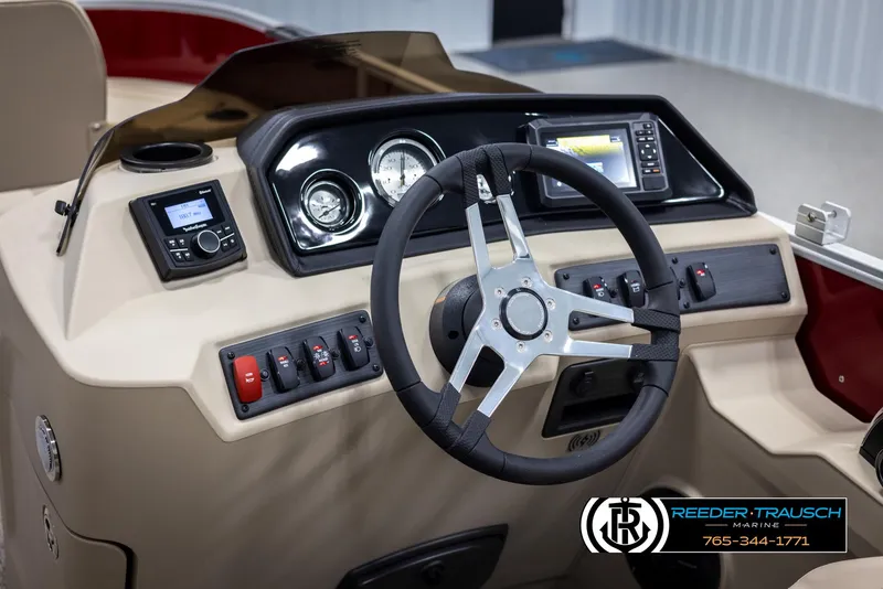 Slide: The Image of 2025 Bennington 188 SSSE boat dashboard with steering wheel and control panel. - 27