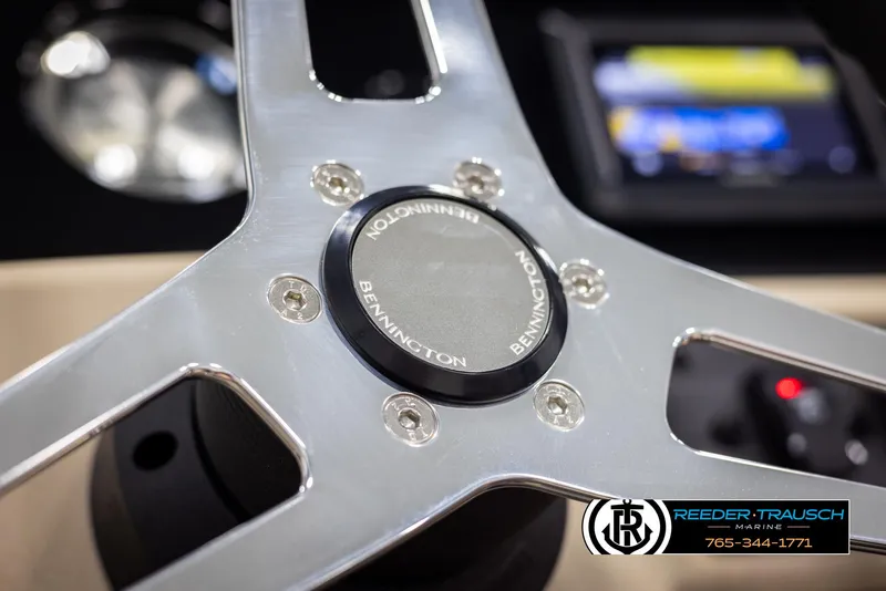 Slide: The Image of Close-up of 2025 Bennington 188 SSSE steering wheel with logo and dashboard in background. - 28