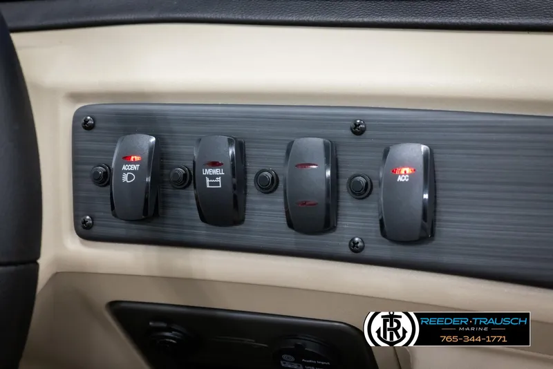 Slide: The Image of 2025 Bennington 188 SSSE dashboard switches with accent lighting and accessory controls. - 33