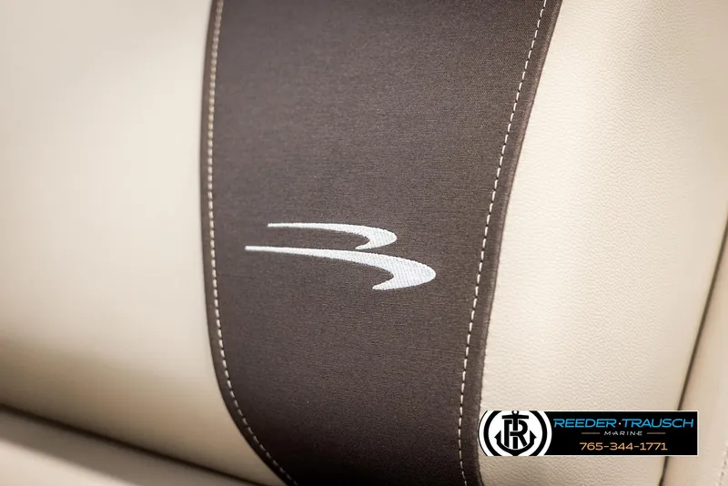 Slide: The Image of 2025 Bennington 188 SSSE boat seat with logo, featuring beige and black upholstery. - 36