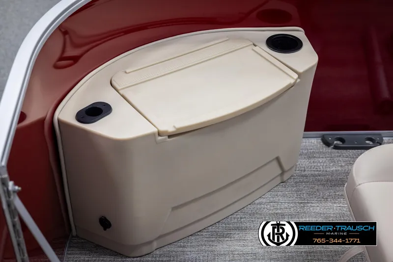 Slide: The Image of 2025 Bennington 188 SSSE boat interior with beige storage compartment and cup holders. - 40