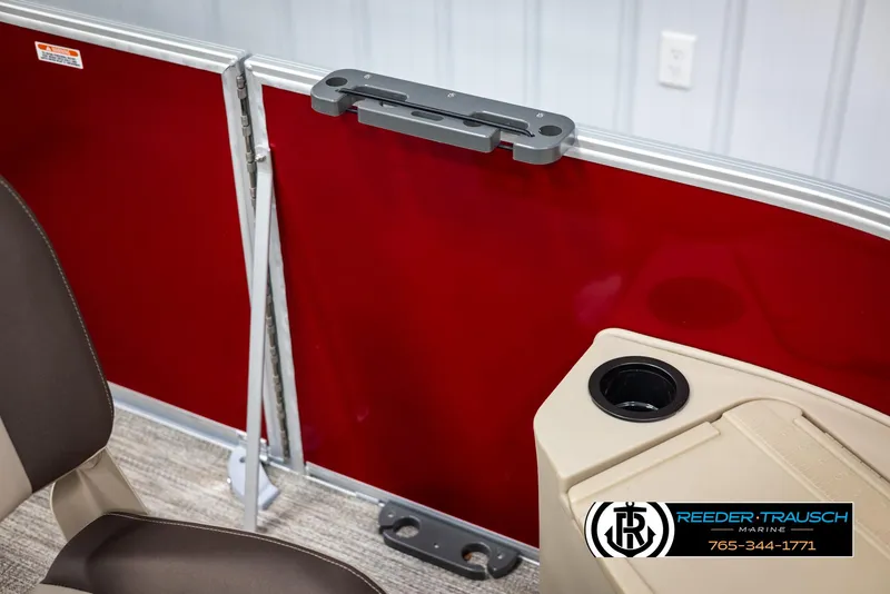 Slide: The Image of 2025 Bennington 188 SSSE boat interior with red panel and cup holder. - 41