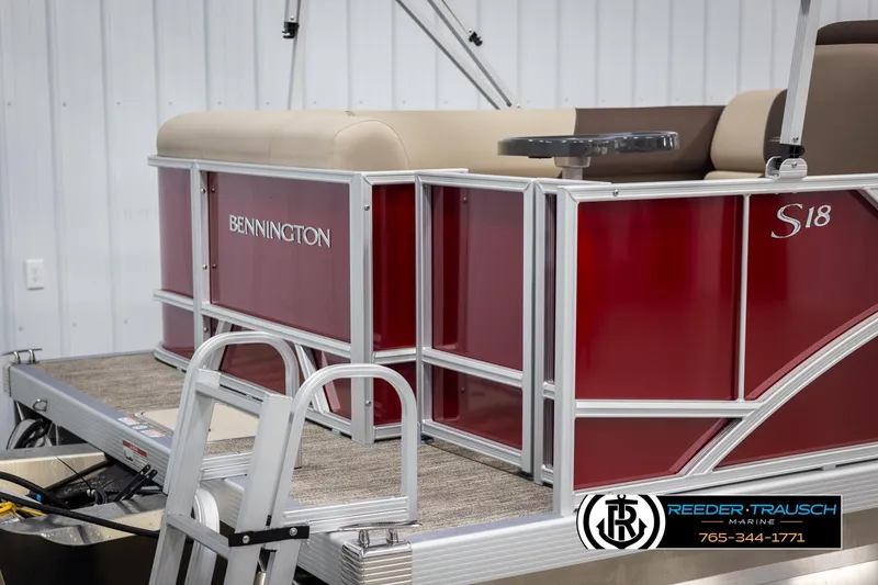 Slide: The Image of 2025 Bennington 188 SSSE pontoon boat, red exterior, docked indoors. - 44