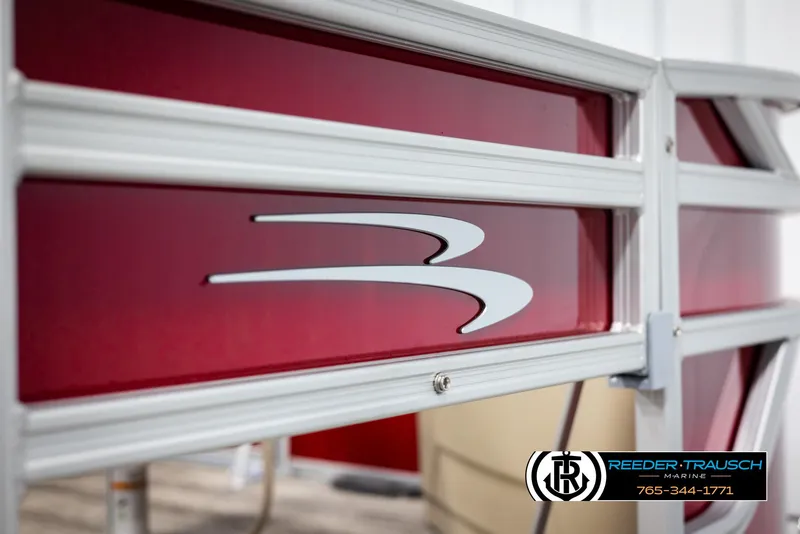 Slide: The Image of 2025 Bennington 188 SSSE boat with red paneling and logo, Reeder-Trausch Marine branding. - 47