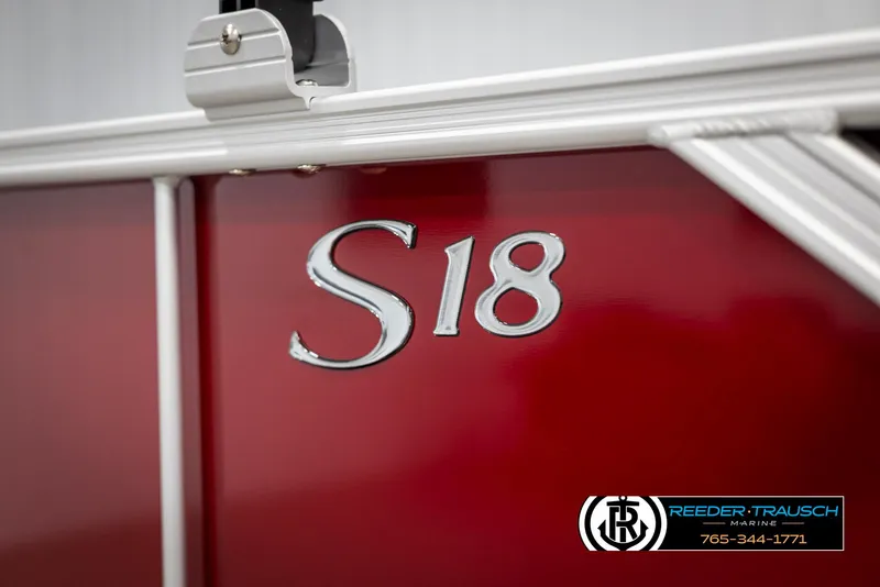 Slide: The Image of Close-up of 2025 Bennington 188 SSSE boat with "S18" emblem on red panel. - 48
